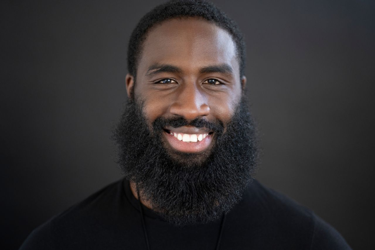 Beard Grooming Tips - Caribbean man with light stubble